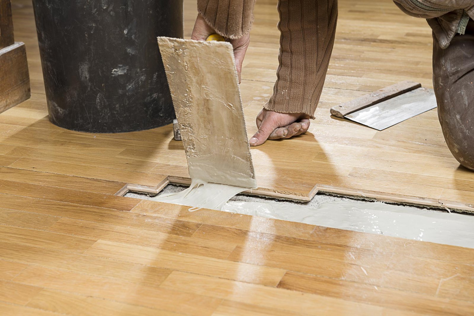 homeguide-contractor-repairing-damaged-hardwood-flooring